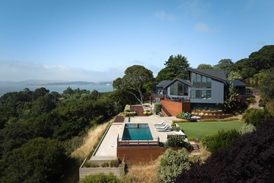 An aerial photo of a home on a bay in California, featuring Marvin Ultimate windows and doors.