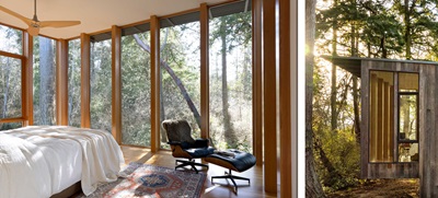 A modern bedroom featuring floor-to-ceiling Marvin Ultimate Direct Glaze windows.