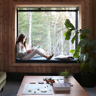 Melissa Coleman sitting in Marvin Skycove at The Minne Stuga cabin in the Northwoods.